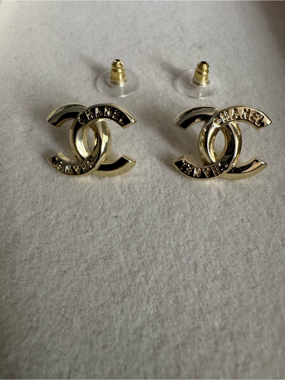 Gold small stud with writing detail